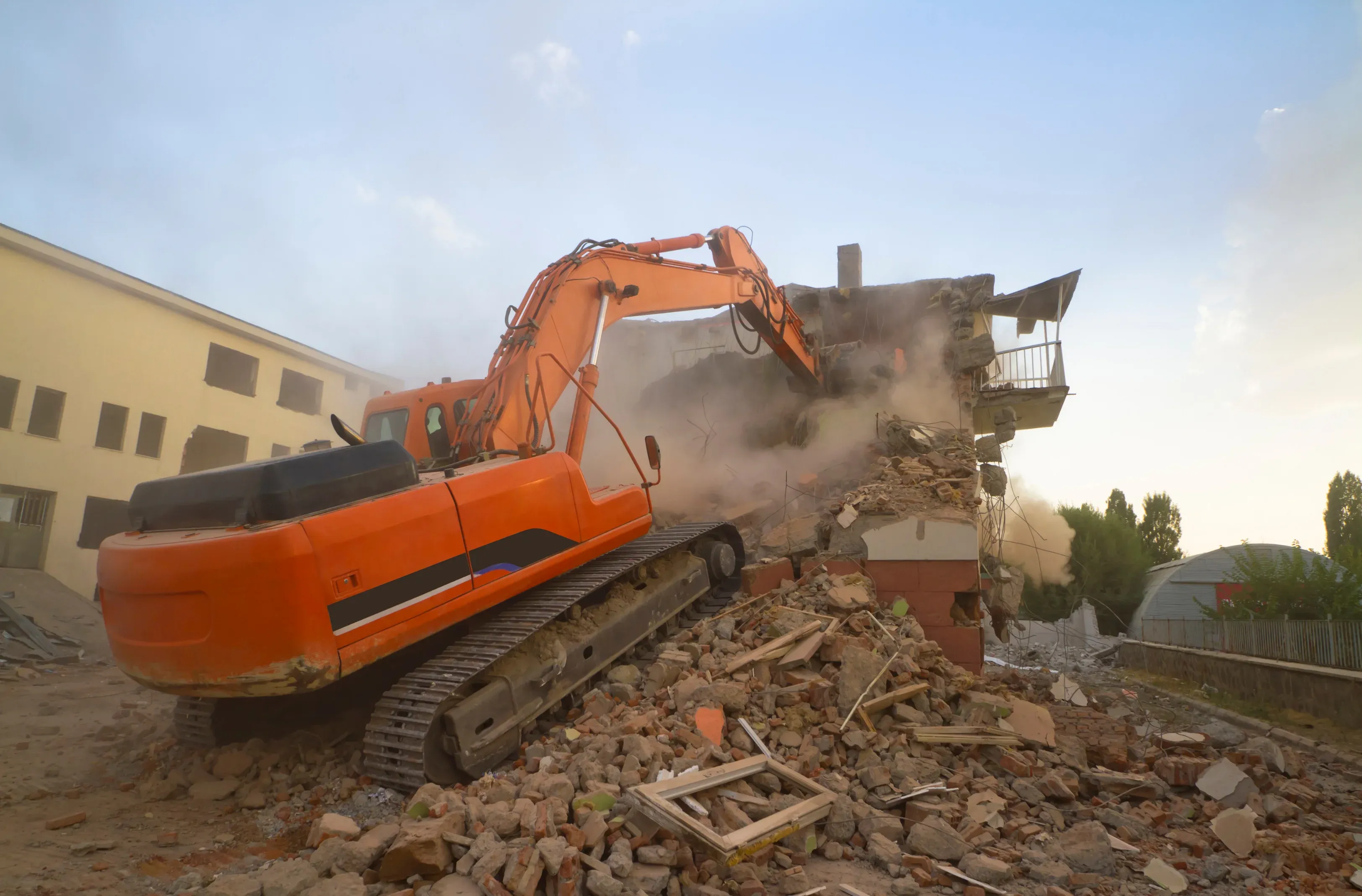Licensed demolition contractor clearing a building site near Cairns