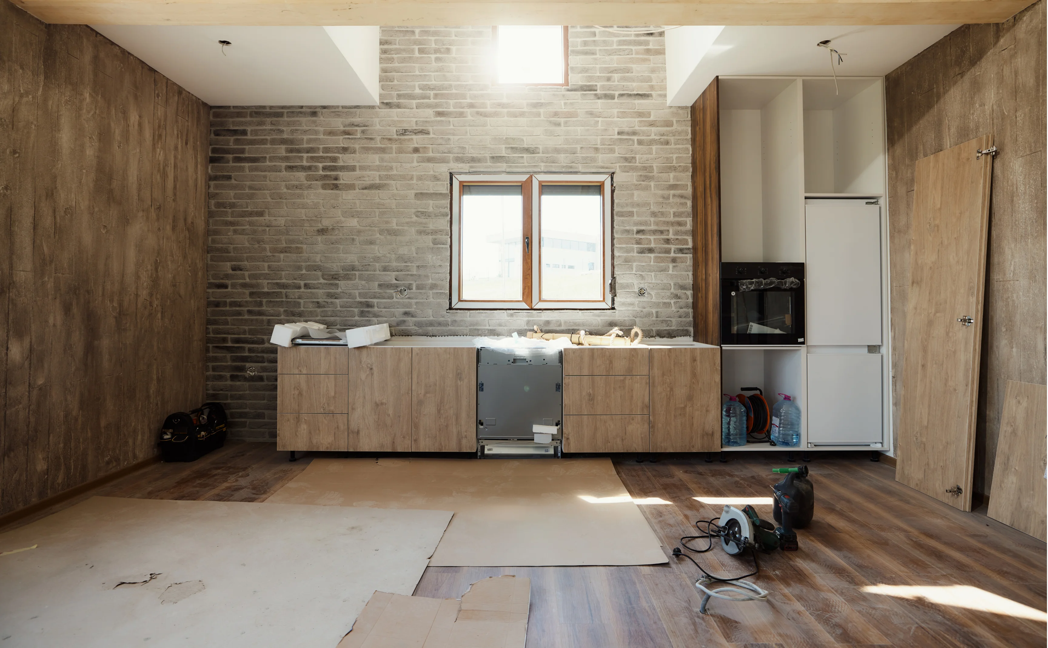Modern kitchen renovation in Australia featuring custom cabinetry installation, stone benchtops, and professional workmanship by licensed builders
