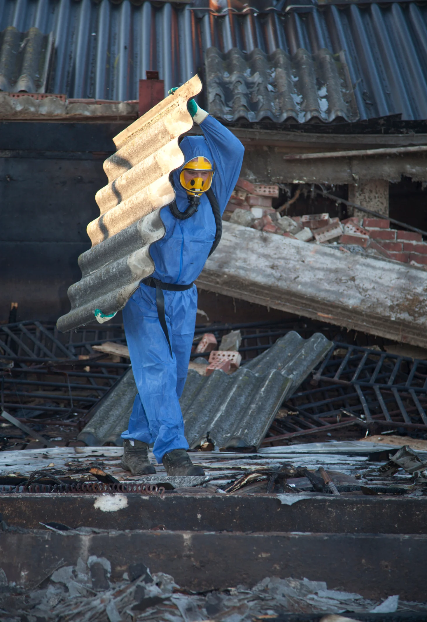 Licensed asbestos removal worker in full PPE safety equipment in Cairns