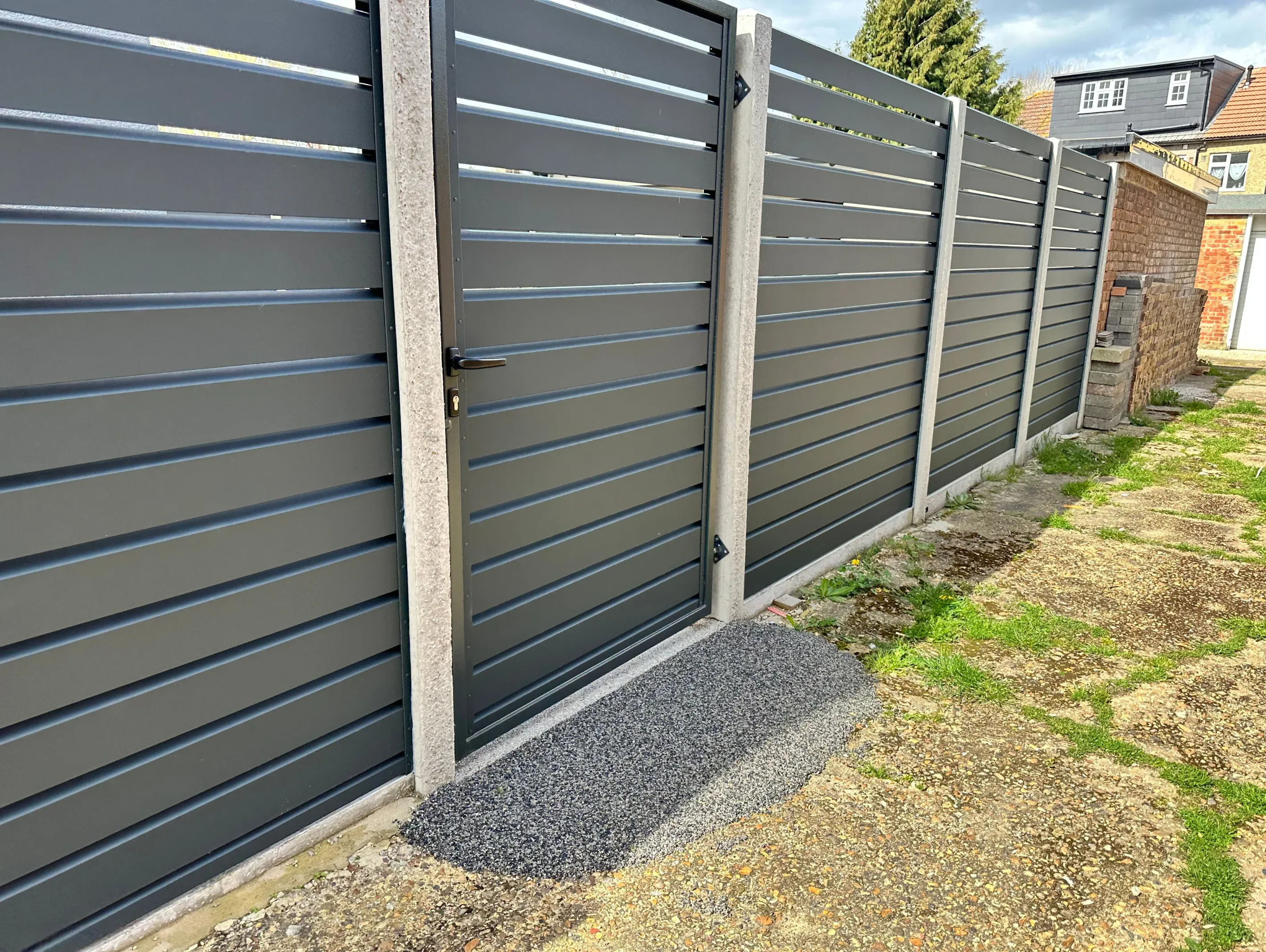 Modern aluminium slat fence and gate in Melbourne