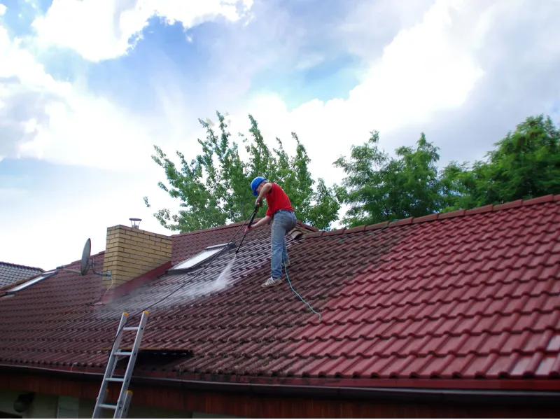 Professional high-pressure roof cleaning in progress on Adelaide tiled roof