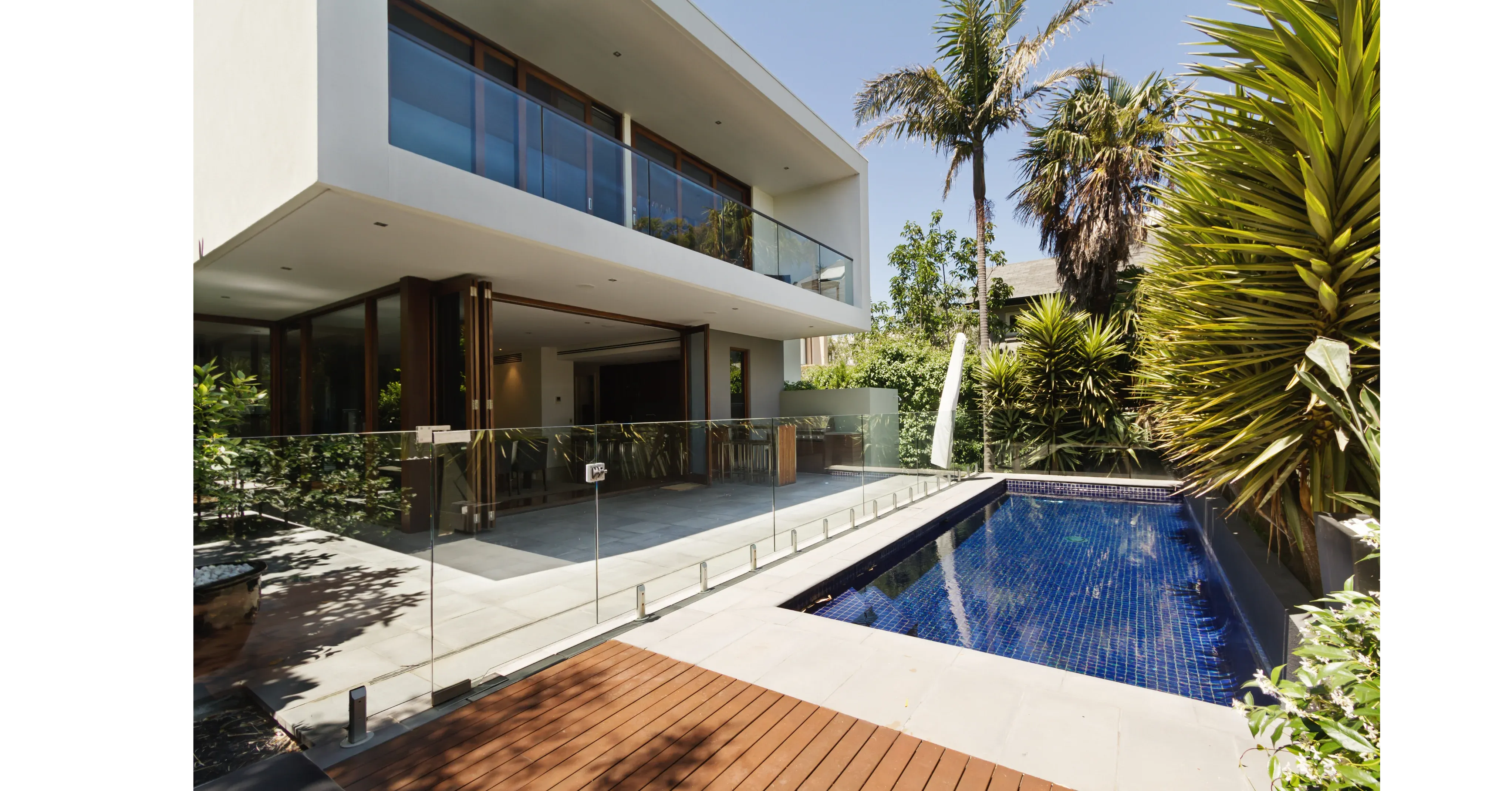 Glass pool fencing around a modern pool in Melbourne